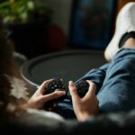 Hands of Woman Playing Video Games