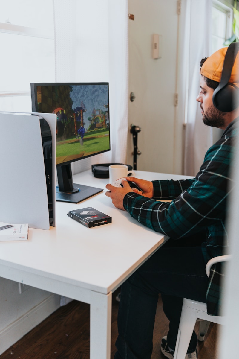 a person wearing a mask and sitting at a desk